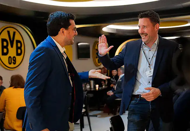 ATZ Group CEO Joscha Dünnwald giving a customer a high five