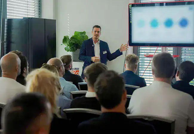 ATZ Group sales employee giving a presentation to an audience