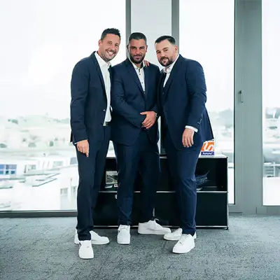 ATZ Group CEOs standing in the ATZ Group office